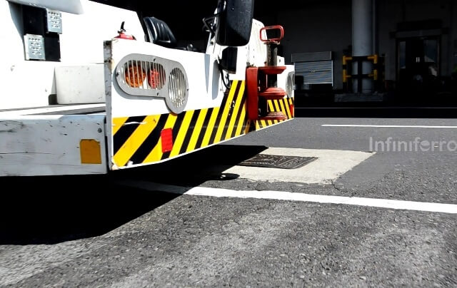 truck passes through manhole cover